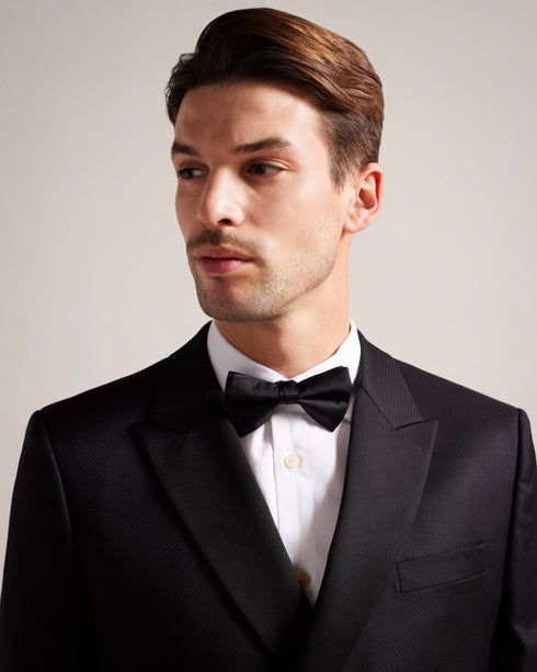 BROSNEY-Ties-The BROSNEY bow tie is the perfect way to add some panache to your look. Made from pure silk, this tie features a ribbed texture for an extra dapper feel. It comes ready-tied for minimal fussing, and has an adjustable neck band for your perfect fit. Bow tie 100% silk Ottoman ribbed texture Pre-tied Adjustable length- Ted Baker Romania
